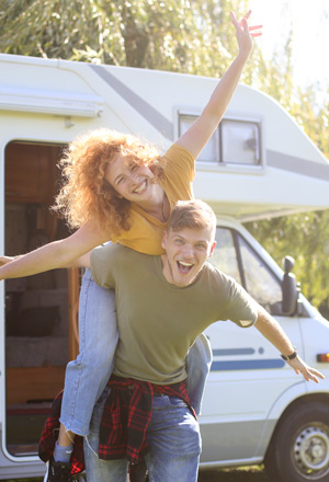 young-boy-and-girl-in-front-of-family-RV