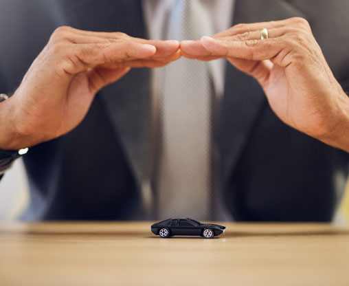 person-handing-over-car-keys-across-a-desk