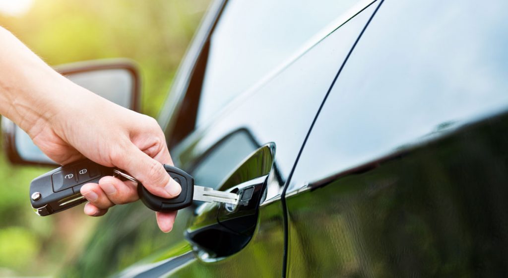 woman-inserting-keys-into-car-door